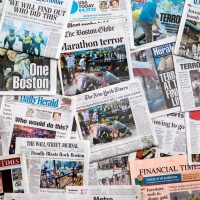 Boston Marathon Bombing headline collage featuring globe