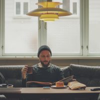 Man relaxed at home, takes a break