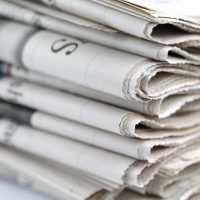 Newspapers folded and stacked concept